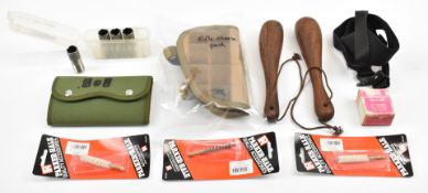 A collection of gun and shooting accessories including four Briley 12 gauge shotgun chokes, cleaning