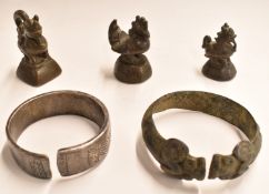 Three bronze opium weights in the form of cockerels together with two bronze and white metal
