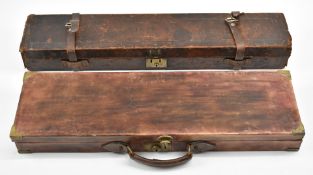 Two leather bound shotgun carry cases, one with 'William Moore & Grey Gun Manufactures 43 Old Bond