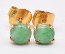 A pair 18ct gold earrings set with a jade cabochons