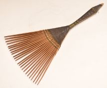 Polynesian carved wooden and wirework comb, 25.5cm long.