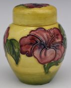 Moorcroft ginger jar decorated in the Hibiscus pattern on a yellow ground, H11cm