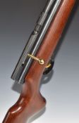 SMK .177 bolt-action air rifle with semi-pistol grip, gilt trigger and raised cheek piece to the