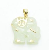 A 9ct gold pendant set with a jadeite elephant