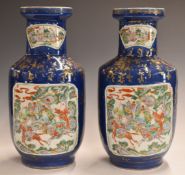 Pair of 19thC Chinese pedestal vases with enamelled decoration of mounted riders / battle scenes,