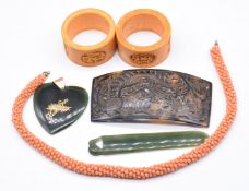 A yellow metal pendant set with a nephrite jade heart, nephrite jade bookmark, tortoiseshell buckle,