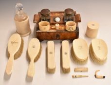 A 19thC blonde tortoiseshell desk stand together with eight ivory backed dressing table brushes
