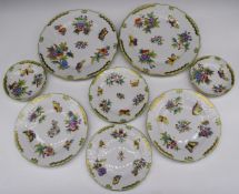 Approximately seventeen pieces of Herend porcelain dinner and teaware decorated in the Queen