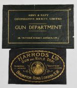 Two gilt embossed leather shotgun case labels 'Harrods Ltd Gun and Rifle Dept' (10x16cm) and 'Army &