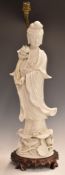 Chinese 19thC blanc de chine figure of Guanyin, converted to a lamp, on carved wooden base, 63cm