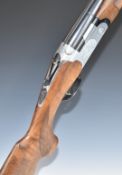 Beretta Model S687 12 bore over and under shotgun with engraved scenes of birds to the locks and