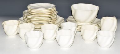 Approximately twenty eight pieces of Coalport dinner and teaware with wrythen marbled decoration