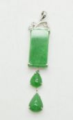 An 18ct white gold pendant set with jadeite and diamonds