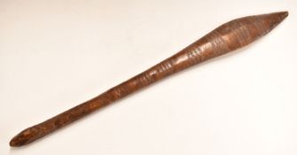 Polynesian or similar tribal club with incised decoration and remnants of old label, 65cm long.