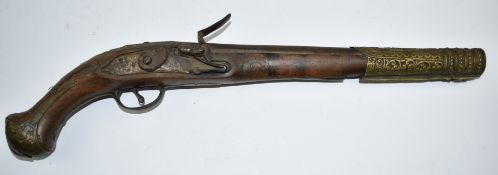 Eastern flintlock pistol with engraved brass trigger guard and butt cap, embossed brass barrel band,