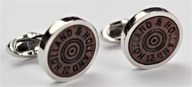 A pair of Holland & Holland cufflinks in the form of shotgun cartridges, in fitted leather case with