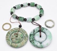 Two Chinese jade rings, carved bead bracelet and two pendants