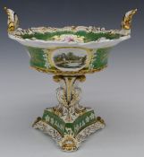A 19thC Davenport twin handled centrepiece with scrolling support and triform base decorated with