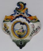 Quimper faience wall pocket with figural decoration, W25 x D33cm