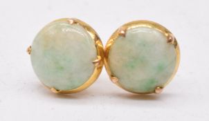 A pair of 18ct gold earrings set with jade cabochons