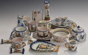A collection of Quimper faience ware including Henriot, candlestick, menu holder, teapot, porringer,