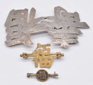 Chinese silver buckle marked KL (possibly Guang Li), silver gilt brooch by Wang Hing and a gilt