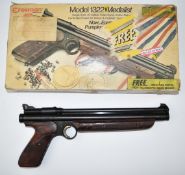 Crosman Model 1322 Medalist .22 target air pistol with shaped and chequered composite grip and