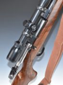 CZ 550 6.5x55 bolt-action rifle with chequered semi-pistol grip and forend, raised cheek piece,