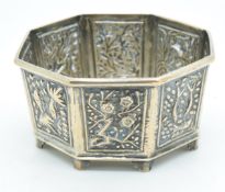 Chinese silver octagonal pot with embossed foliate decoration and character marks to base, width 7.