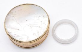 Chinese jade ring and a silver gilt pot set with mother of pearl depicting a fishing scene