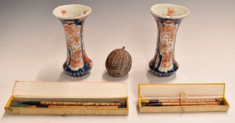 A pair of Japanese Imari vases, 16cm tall and two sets of bamboo Chinese paint brushes with engraved