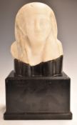 A 19th/20thC Grand Tour alabaster Egyptian head on ebonised stand, 34cm tall.