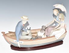 Lladro figural group Love Boat of a family with dog in rowing boat named Amour on wooden base,
