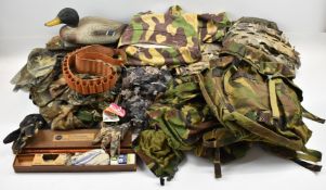 A collection of Realtree and similar camouflage clothing and accessories including Advantage ghillie
