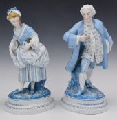 A pair of Continental figures, he holding a hat and she with a prayer book, H34.6cm