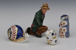 Royal Crown Derby Imari paperweights and a Royal Doulton character figure The Poacher, tallest 16cm