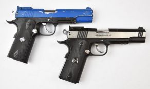 Two G&G Armament Xtreme 45 air pistols, both with monogrammed and chequered grips, serial numbers