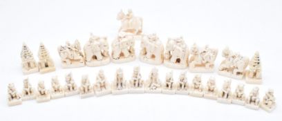 Collection of carved bone chess or similar pieces, possibly prisoner of war, tallest 3.5cm