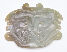 Chinese 19thC archaic jade pendant depicting a stylised Fu dog, 7 x 5.8cm