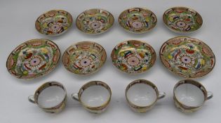 Twelve pieces of Worcester porcelain teaware decorated in the 'Dragons in Compartments' pattern