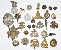 Small collection of metal badges including London Rifle Brigade, Royal Artillery, Scots Guards,