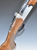 Midland 12 bore over and under shotgun with engraved lock, underside, trigger guard, top plate and