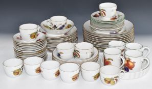 Approximately sixty four pieces of Royal Worcester Evesham and Evesham Gold dinner and teaware