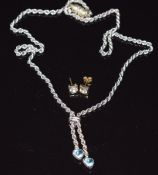 A 9ct white gold necklace set with blue topaz and a pair of 9ct gold earrings set with paste, 4.3g