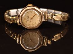Bentina Star 9ct gold ladies wristwatch with gold hands and Arabic numerals and silver dial, on gold