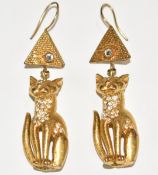 A pair of Askew earrings in the form of cats
