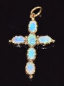 A 9ct gold cross pendant set with opals, 2.6cm, 0.9g
