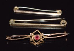 Two 9ct gold brooches and a 9ct gold brooch set with a garnet and seed pearls, 5g