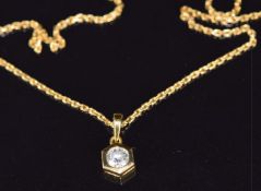 An 18ct gold pendant set with a diamond of approximately 0.35ct (1.4g) on 22k gold chain, 3.8g,