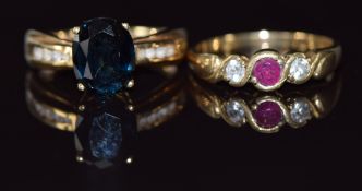 Two 9ct gold rings, one set with a ruby and cubic zirconia the other a sapphire and cubic